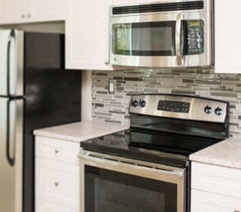 GE stainless steel appliances in a 1900 Arch kitchen